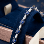 Alternating Blue Sapphire Oval & Baguette Cut Tennis Bracelet For Women
