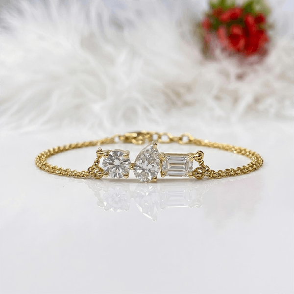 Three Stone Yellow Gold Pear & Emerald & Round Cut White Sapphire Chain Bracelet For Women