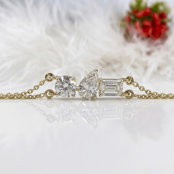 Three Stone Yellow Gold Pear & Emerald & Round Cut White Sapphire Chain Bracelet For Women
