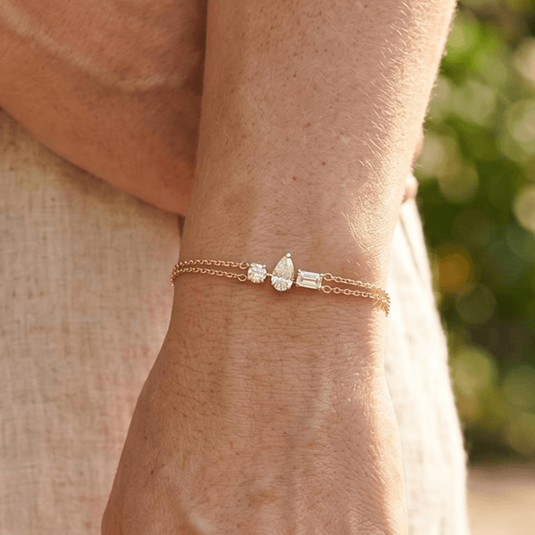 Three Stone Yellow Gold Pear & Emerald & Round Cut White Sapphire Chain Bracelet For Women