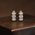 Classic Three Stone Yellow Gold Oval Cut White Sapphire Hoop Earrings For Women