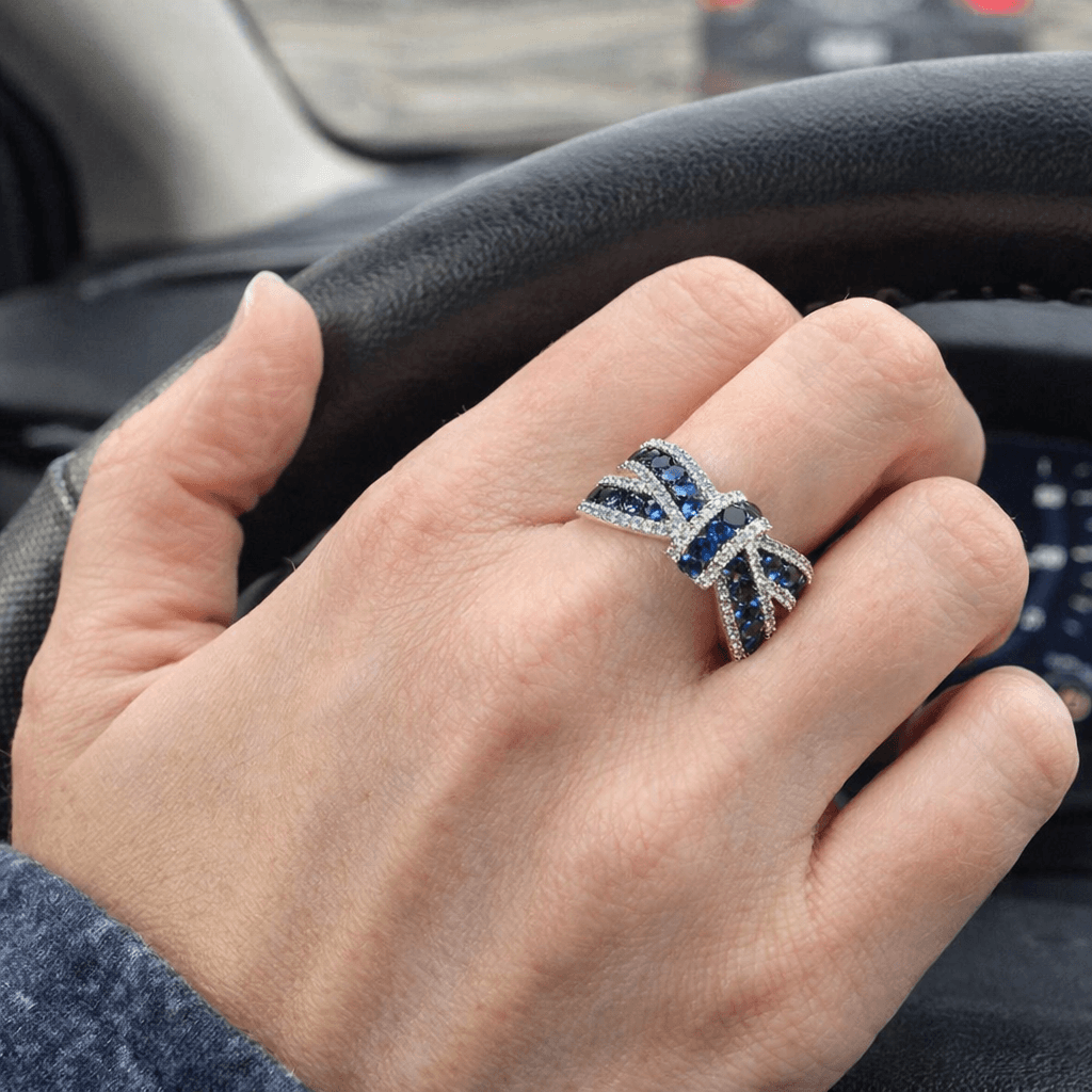 Elegant Knot Design Round Cut Blue & White Sapphire Half Eternity Wedding Band For Women