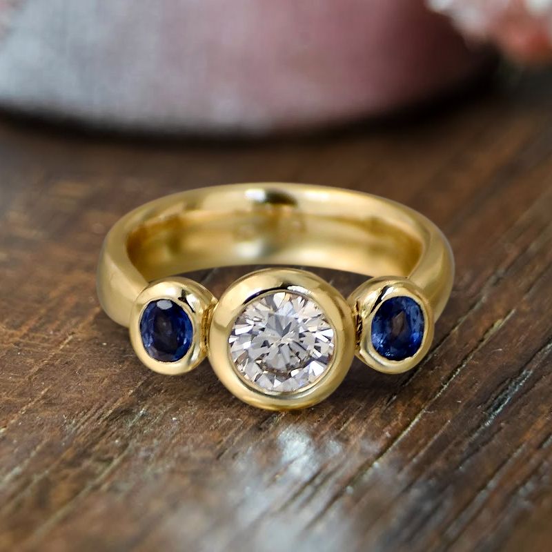Bezel Round & Oval Cut White & Blue Sapphire Three Stone Engagement Ring For Women Belovegrace