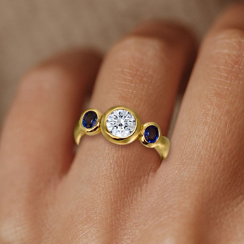Bezel Round & Oval Cut White & Blue Sapphire Three Stone Engagement Ring For Women Belovegrace
