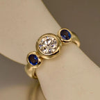 Bezel Round & Oval Cut White & Blue Sapphire Three Stone Engagement Ring For Women Belovegrace