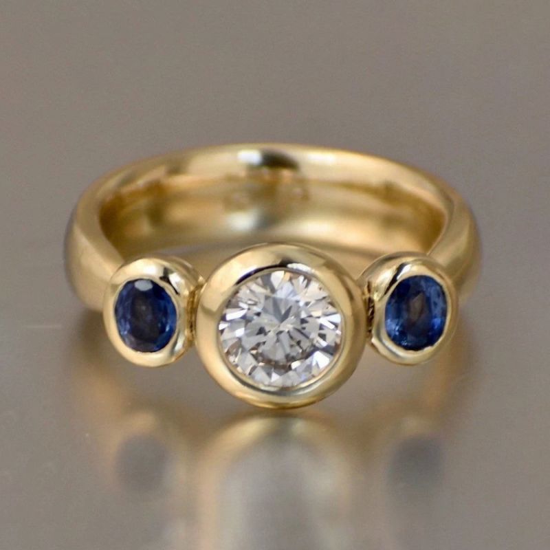 Bezel Round & Oval Cut White & Blue Sapphire Three Stone Engagement Ring For Women Belovegrace