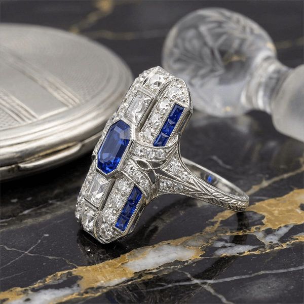 Art Deco Bezel Emerald Cut Blue Sapphire Halo Engagement Ring