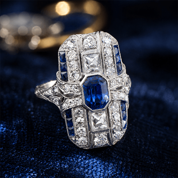Art Deco Bezel Emerald Cut Blue Sapphire Halo Engagement Ring