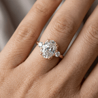 Classic Three Stone Oval Cut White Sapphire Engagement Ring In Yellow Gold