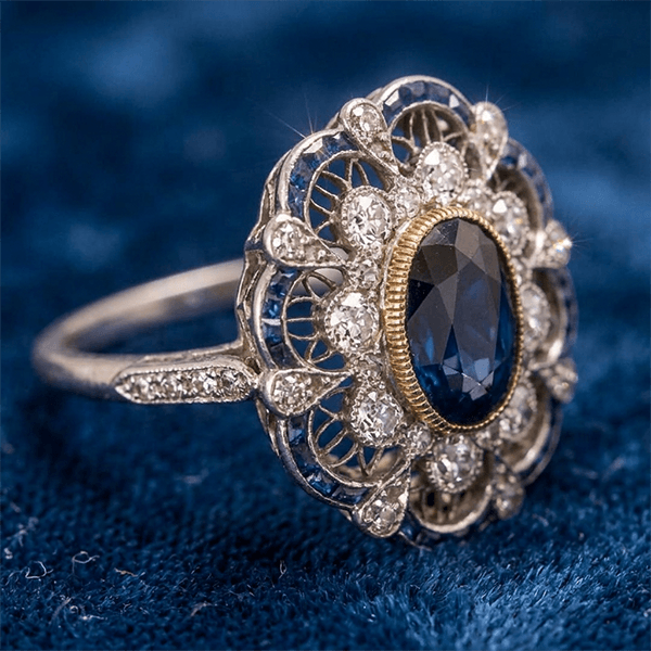 Art Deco Two Tone Halo Oval Cut Blue Sapphire Engagement Ring