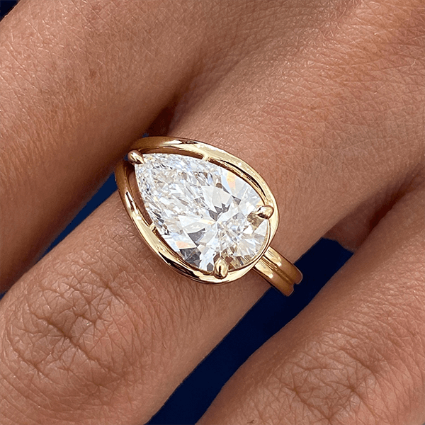 Unique Design Golden Solitaire Split Shank Pear Cut White Sapphire Engagement Rings