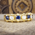 Unique Design Golden Round Cut Blue & White Sapphire Wedding Band