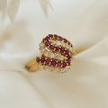 Yellow Gold Swirl Design Round Cut Ruby & White Sapphire Cocktail Band