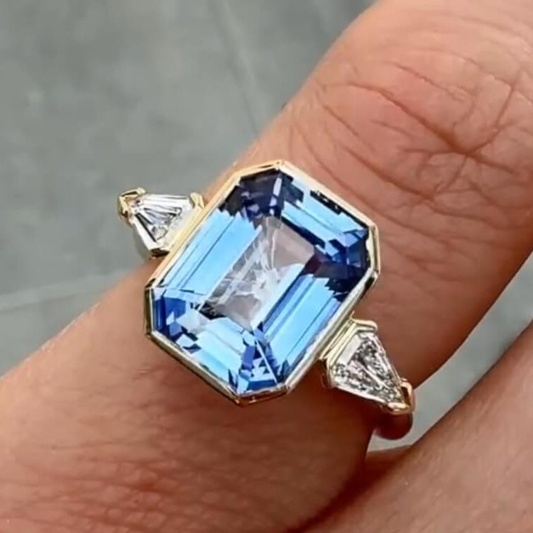 Three Stone Yellow Gold Bezel Emerald Cut Blue Sapphire Engagement Ring