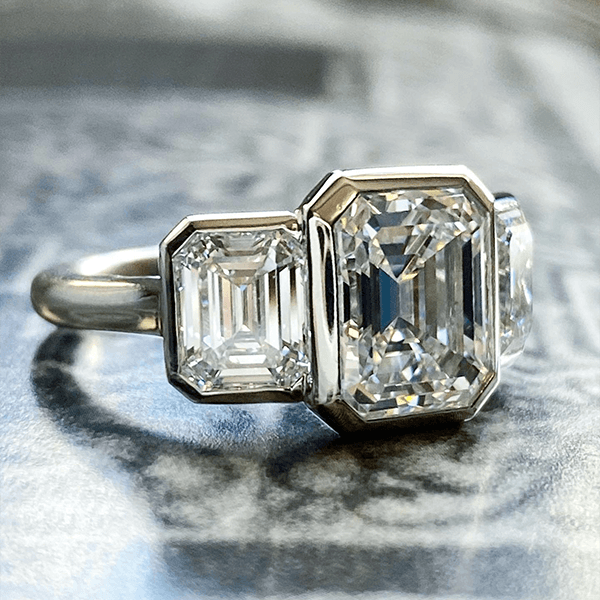 Classic Bezel Three Stone Emerald Cut White Sapphire Engagement Ring