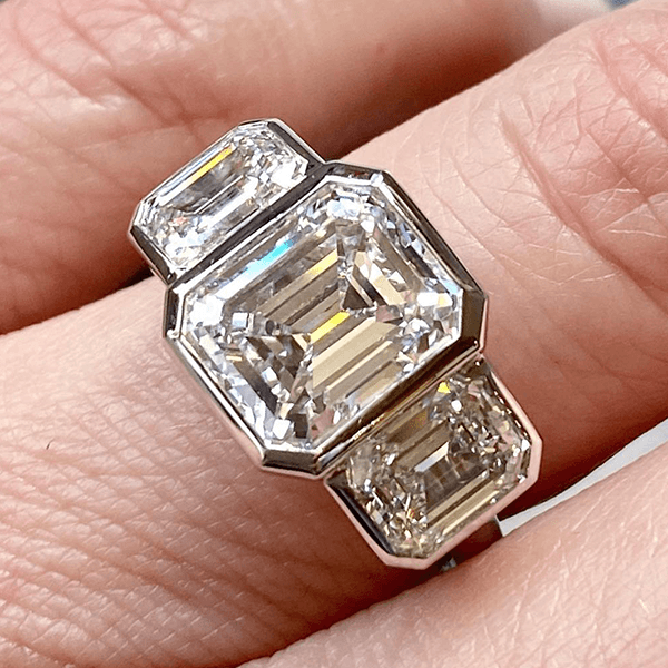 Classic Bezel Three Stone Emerald Cut White Sapphire Engagement Ring