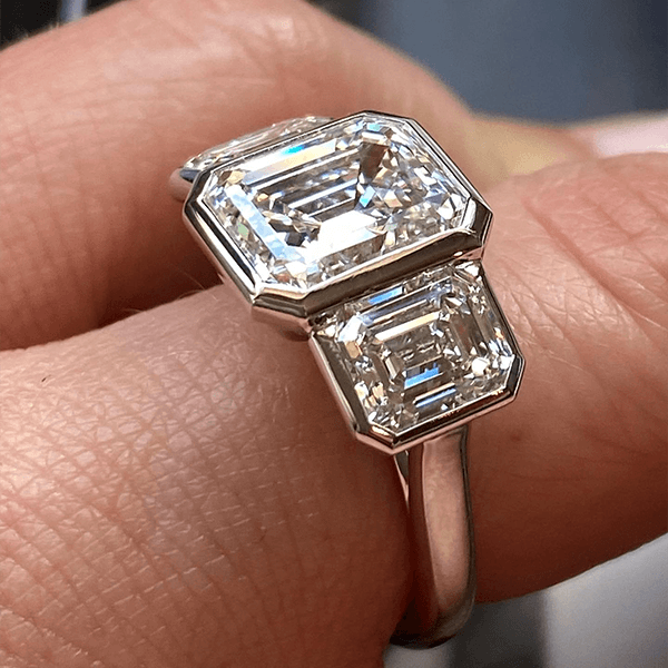 Classic Bezel Three Stone Emerald Cut White Sapphire Engagement Ring