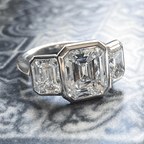 Classic Bezel Three Stone Emerald Cut White Sapphire Engagement Ring