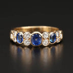 Vintage Yellow Gold Bezel Oval Cut Blue Sapphire Half Eternity Wedding Band For Women