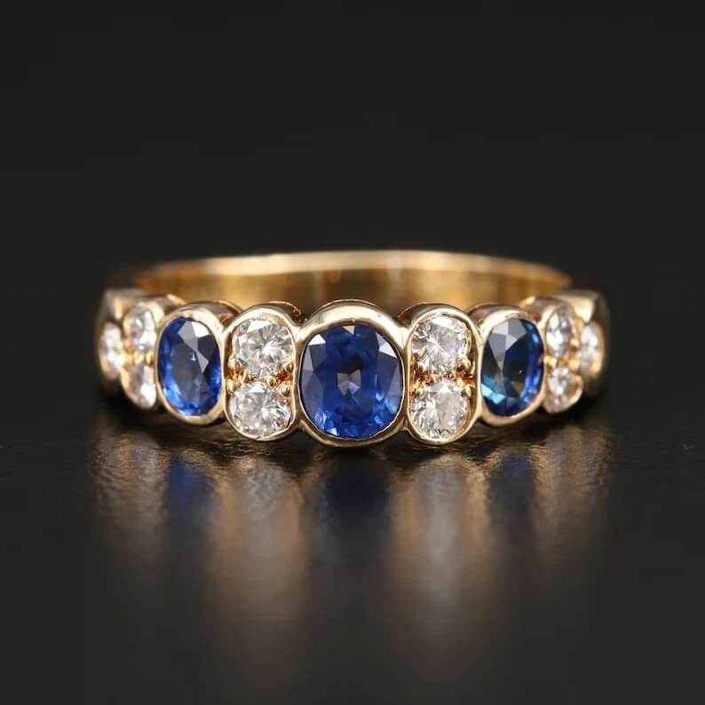 Vintage Yellow Gold Bezel Oval Cut Blue Sapphire Half Eternity Wedding Band For Women